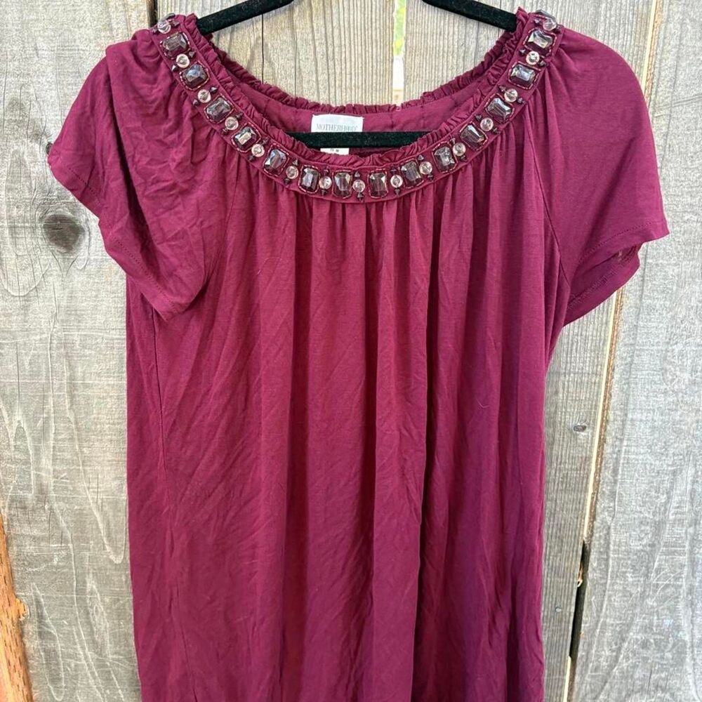 Motherhood Maternity short sleeve top in a rich burgundy color